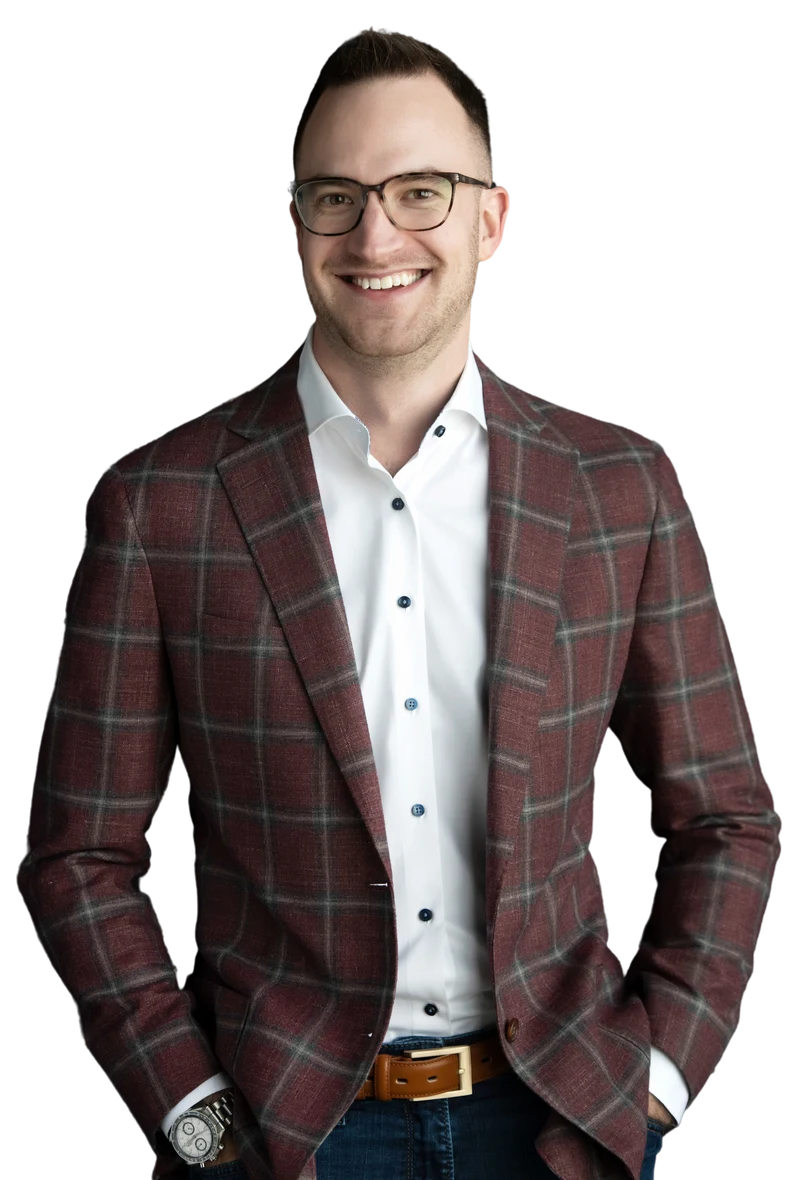 James Green, founder of Dominion AI, standing in a dark suit